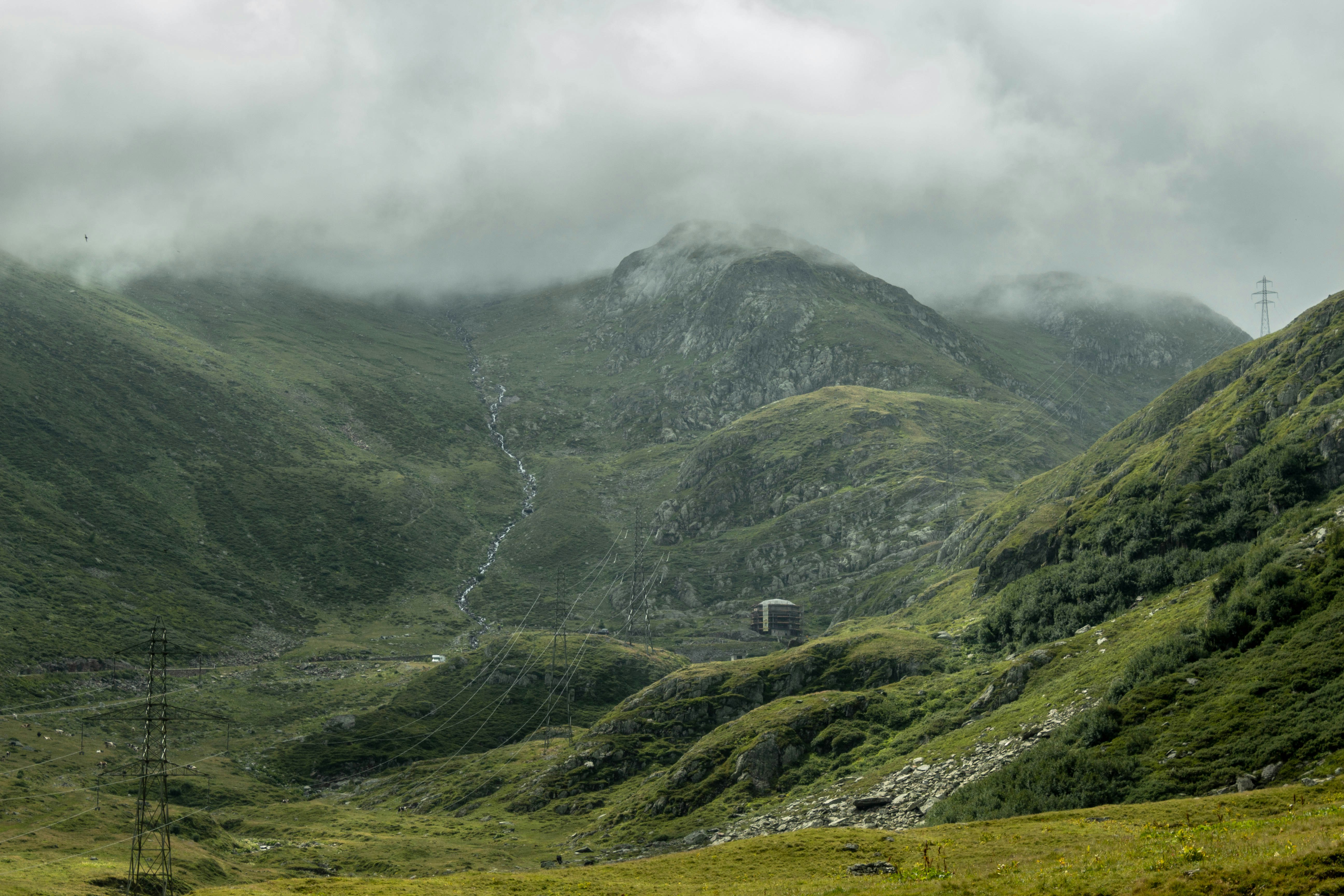 green and gray mountains under white clouds during daytime